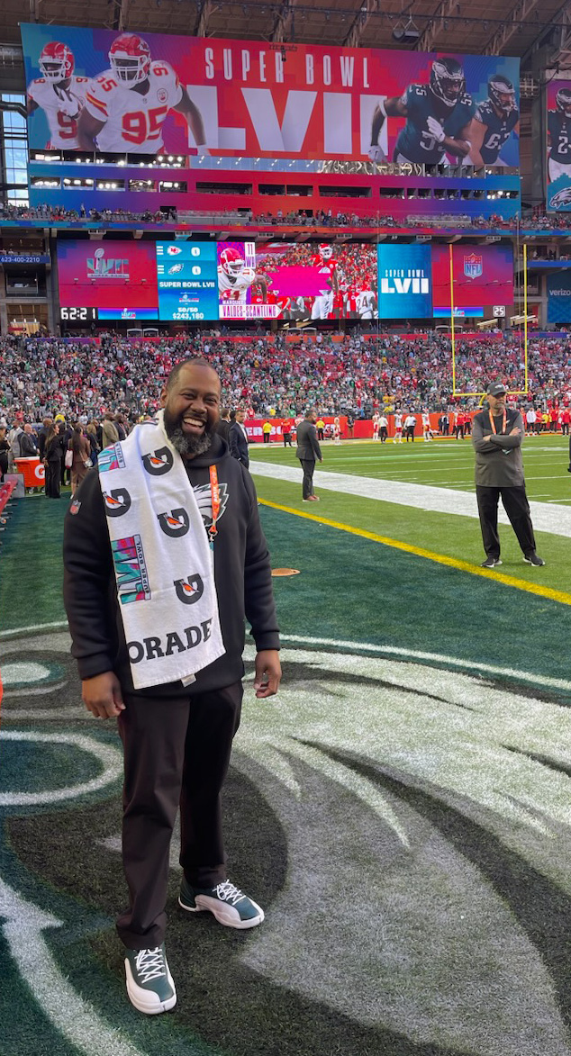 Jerome Reid stands on the field at Super Bowl 57