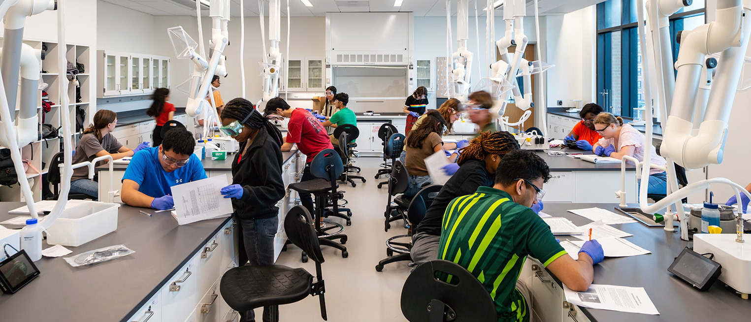 Students work at lab stations in a science classroom