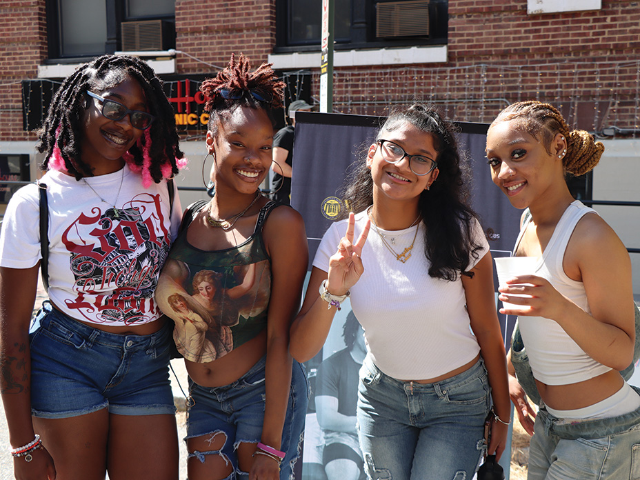 Four students pose outside on VCU's campus