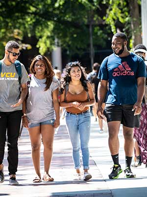 four v.c.u. students walking together to class near cabell library