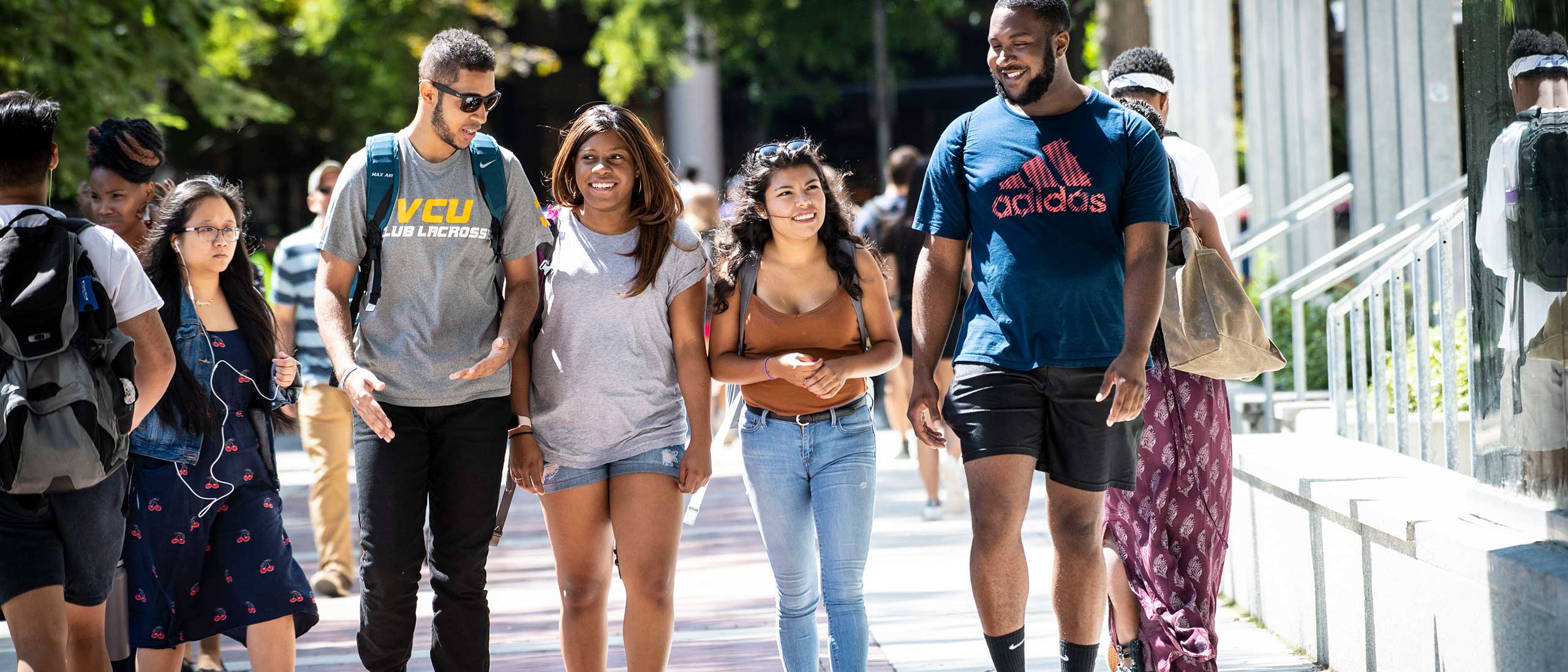 four v.c.u. students walking together to class near cabell library