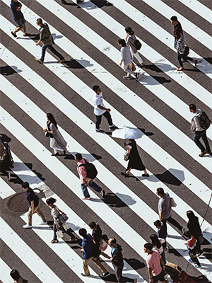 aerial shot of people walking in a large crosswalk