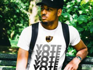student with a v.c.u. t-shirt that reads 'vote' multiple times