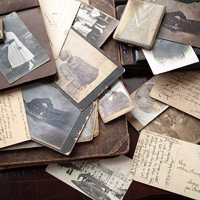 a scattered pile of historic photos and letters
