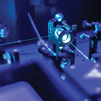 lasers on an optic table in a quantum laboratory