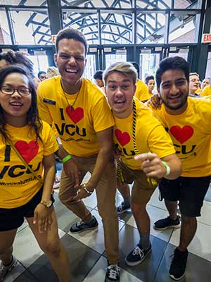 four v.c.u. students with bright t-shirts that read 'i love v.c.u.'