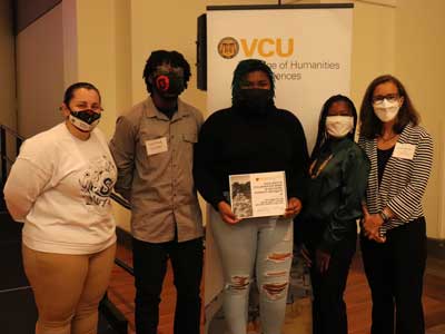 the Committee for Racial Equity Student Advisory Group posing with dean jennifer malat at an awards ceremony