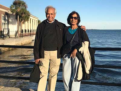 puru and tripti jena on a sunny oceanfront