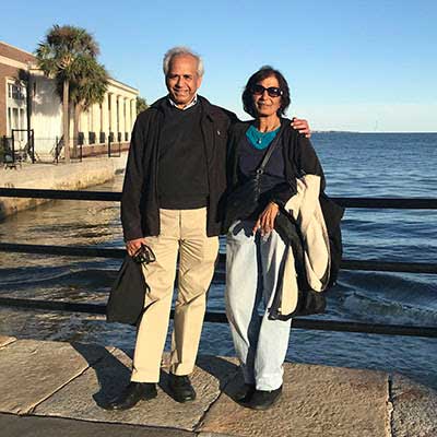 puru and tripti jena on a sunny oceanfront